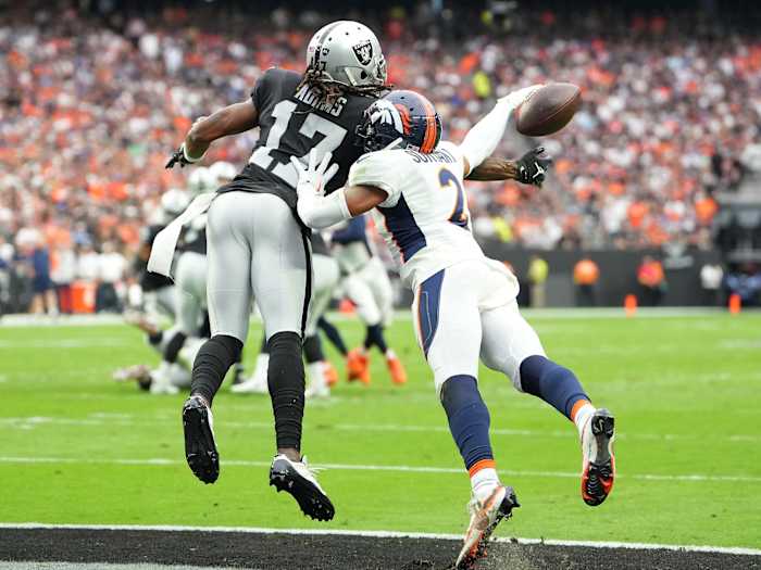 Denver Broncos cornerback Pat Surtain II (2) breaks up a pass intended for Las Vegas Raiders wide receiver Davante Adams (17) during a game at Allegiant Stadium.